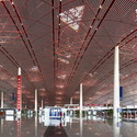 Foster + Partners designed the Beijing Airport, which opened in 2008 with a “soaring aerodynamic roof and dragon-like form [that] celebrate the thrill and poetry of flight and evoke traditional Chinese colours and symbols” with red and yellow triangular skylights.
