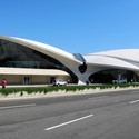 Saarinen's fabulous TWA terminal at JFK International still stands as the finest airport poetry in motion. The Saarinen creations came just after Paul Williams of Pereira & Luckman designed the quaint “flying saucer” with circular restaurant suspended from two large arches at the entrance to the LAX airport in Los Angeles. Image © Flickr CC user Wally Gobetz