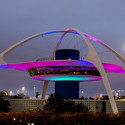 The “flying saucer” theme building at the entrance of LAX, a fine demonstration how drama and surprise can conquer sprawl. The airport spruced up its welcome mat in 1991 with the erection of its 15, super “landing lights,” high-tech, thirty-foot-high pylons that cycle through a rainbow of colors celebrating the city's multicultural make-up. Image © Flickr CC user Thomas Hawk