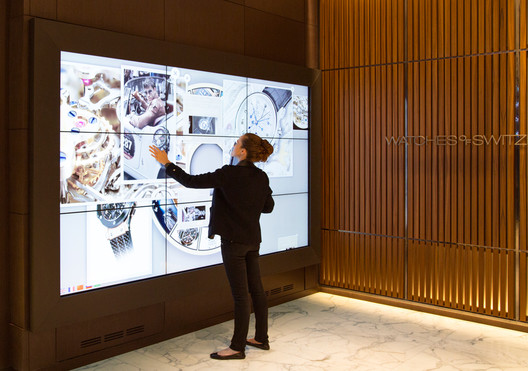Designed by Callison, the new Watches of Switzerland store in London features an interactive touch screen. Image Courtesy of Callison