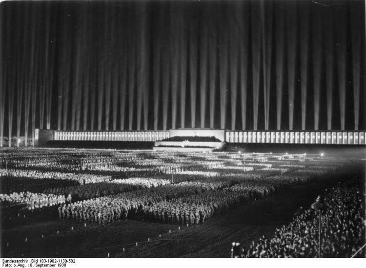 Zeppelinfeld Stadium, Albert Speer. Image Courtesy of Bundesarchiv, Bild 183-1982-1130-502 <a href='https://commons.wikimedia.org/wiki/File:Bundesarchiv_Bild_183-1982-1130-502,_N%C3%BCrnberg,_Reichsparteitag,_Lichtdom.jpg'>via Wikimedia</a> licensed under <a href='http://https://creativecommons.org/licenses/by-sa/3.0/de/deed.en'>CC BY-SA 3.0 DE</a>