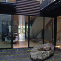 Courtyard House on a Steep Site / Hutchison & Maul Architecture - Houses, Facade, Door, Beam, Stairs, Table, Chair, Bench