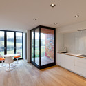 Apartment Building in Luxembourg / Metaform Architects - Apartments, Kitchen, Door, Facade, Beam, Countertop, Chair, Table