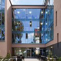 Veronica House Elderly Care Facility / f m b architekten -  Healthcare Center, Courtyard, Facade, Table, Chair