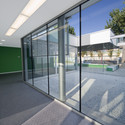 Escuela Infantil La Mercè / Pampols Arquitecte + BmésR29 Arquitectes + Montserrat Giné - Kindergarten, Puerta, Fachada, Barandas, Sillas