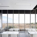 Edificio 112 / ACXT Arquitectos - Servicios De Emergencia, Cocina, Fachada, Balcón, Barandas, Sillas, Mesas