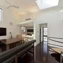 House in Shimomaruko / Atelier HAKO Architects  - Houses, Kitchen, Door, Beam, Handrail, Table, Lighting, Chair, Countertop