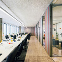 Kinematix / LIKEarchitects - Offices Interiors, Door, Facade, Table, Chair