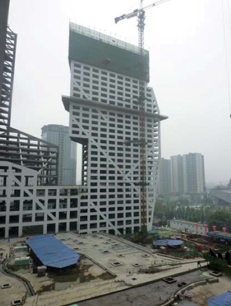 Steven Holl Architects' Sliced Porosity Block Tops Out