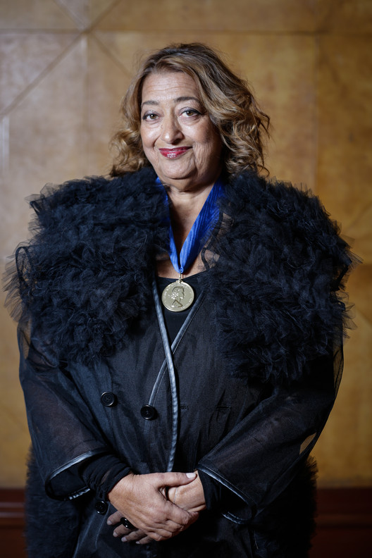 Dame Zaha Hadid wearing the 2016 RIBA Royal Gold Medal. Image © Sophie Mutevelian