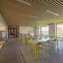 Non-residential Day Camp Centre in Givors / Tectoniques Architect - Community Center, Handrail, Beam, Table, Chair