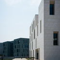 The Elegance of the White, the Charm of the Cube / STI Studio  - Library, Facade