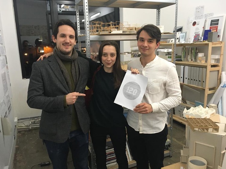 120 HOURS Project Manager, Seweryn Zawada (left), awarded the first prize diploma to Agenieszka Kołacińska (middle) and Jakub Andrzejewski (right) in a surprise visit Sunday evening. Image Courtesy of 120 Hours