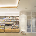 Albayda Pharmacy / avila arquitectos - Interior Photography, Pharmacy, Lighting, Chair