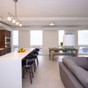 Lofts at Mayo Park / Snow Kreilich Architects - Apartments, Kitchen, Table, Lighting, Countertop, Chair