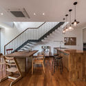 Y House / Anonym - Houses, Kitchen, Stairs, Beam, Door, Handrail, Table, Chair, Countertop, Lighting