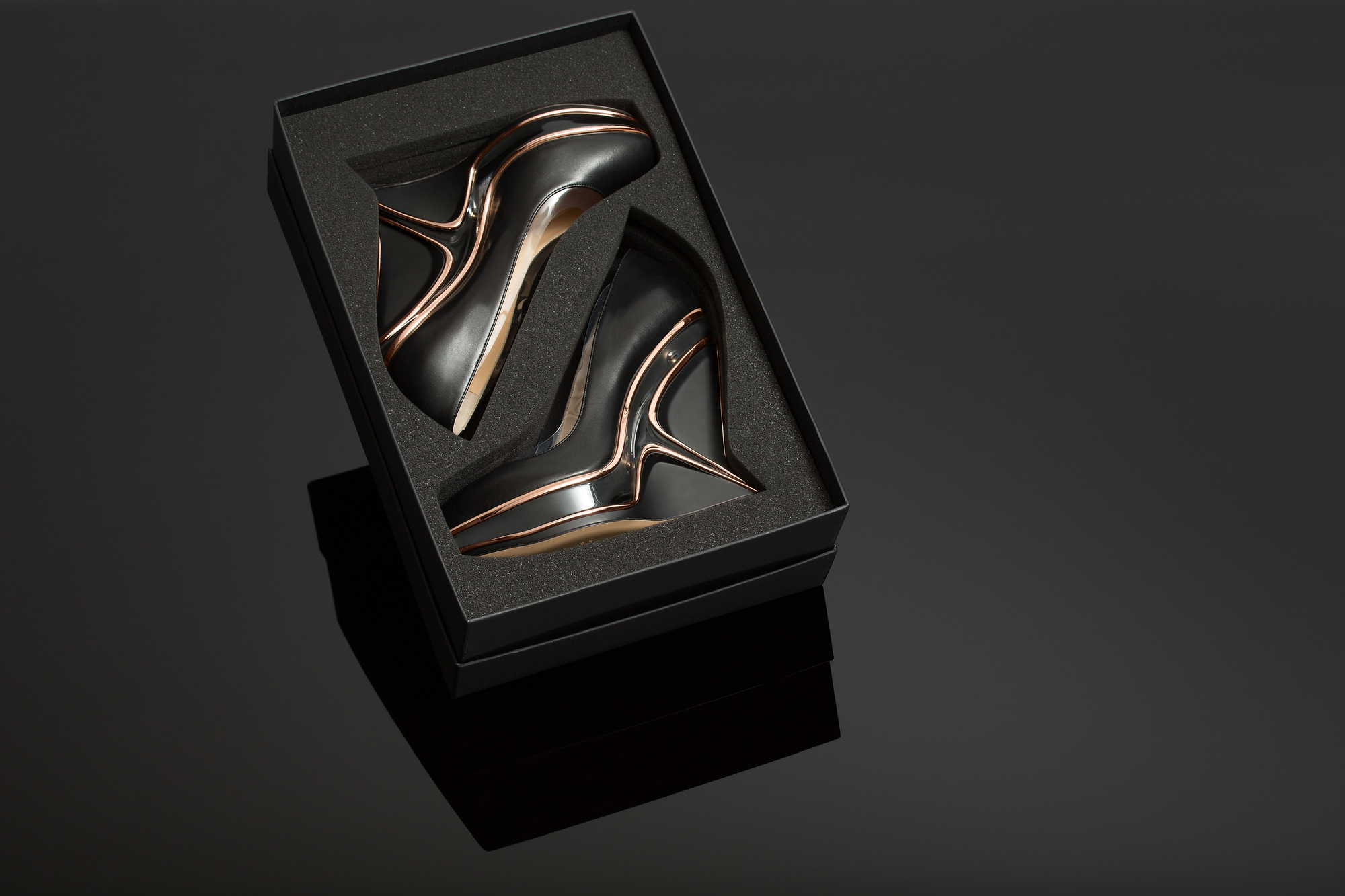 Gallery of Zaha Hadid Design Creates Shoe and Transparent Clutch Bag