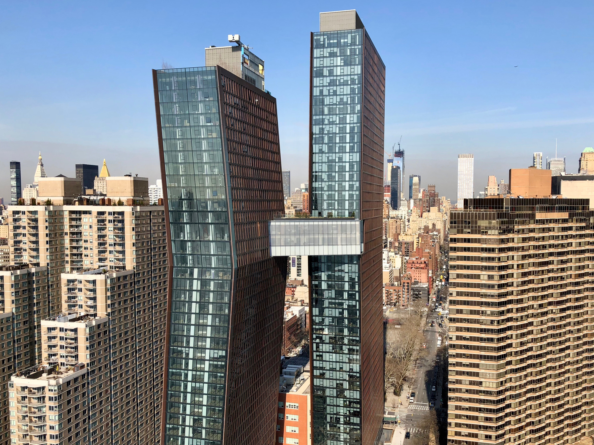 Gallery of Transparency and Connectivity: The Glass Skybridge Linking : The astonishing picture capturing a stunning view. Its tones are vibrant and blend perfectly. The layout looks great, and its features are also extremely sharp.