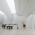 Sculpted Light: Upper level gallery of the Jumex Museum by David Chipperfield (David Chipperfield Architects). Large skylight monitors with diffusing filters provide even illumination in the top-floor gallery and control the abundant sunlight and solar-heat gains. Image © Simon Menges