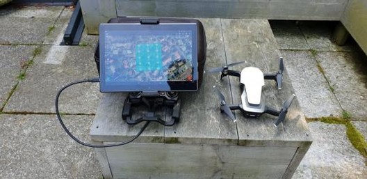 10-inch tablet and tablet holder next to the DJI Mavic Air. Image Courtesy of Lumion