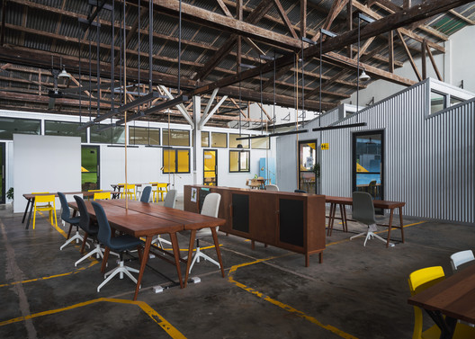 Factory Phnom Penh Social Hub / Bloom Architecture - Interior Photography, Dining room, Table, Windows, Beam, Chair
