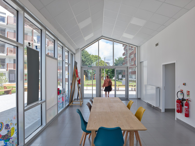 Le Cours des Arts, Living Diversity in Beauregard / a/LTA - Windows, Table, Chair, Door