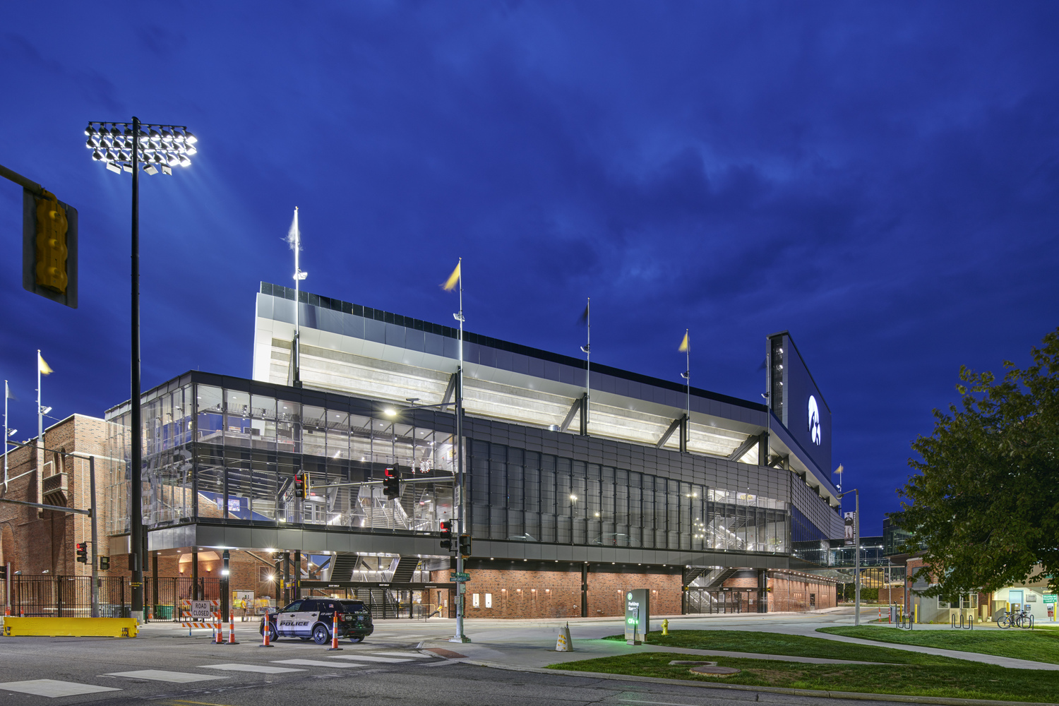 Gallery of How to Construct a Stadium Facade from Custom Glass While on