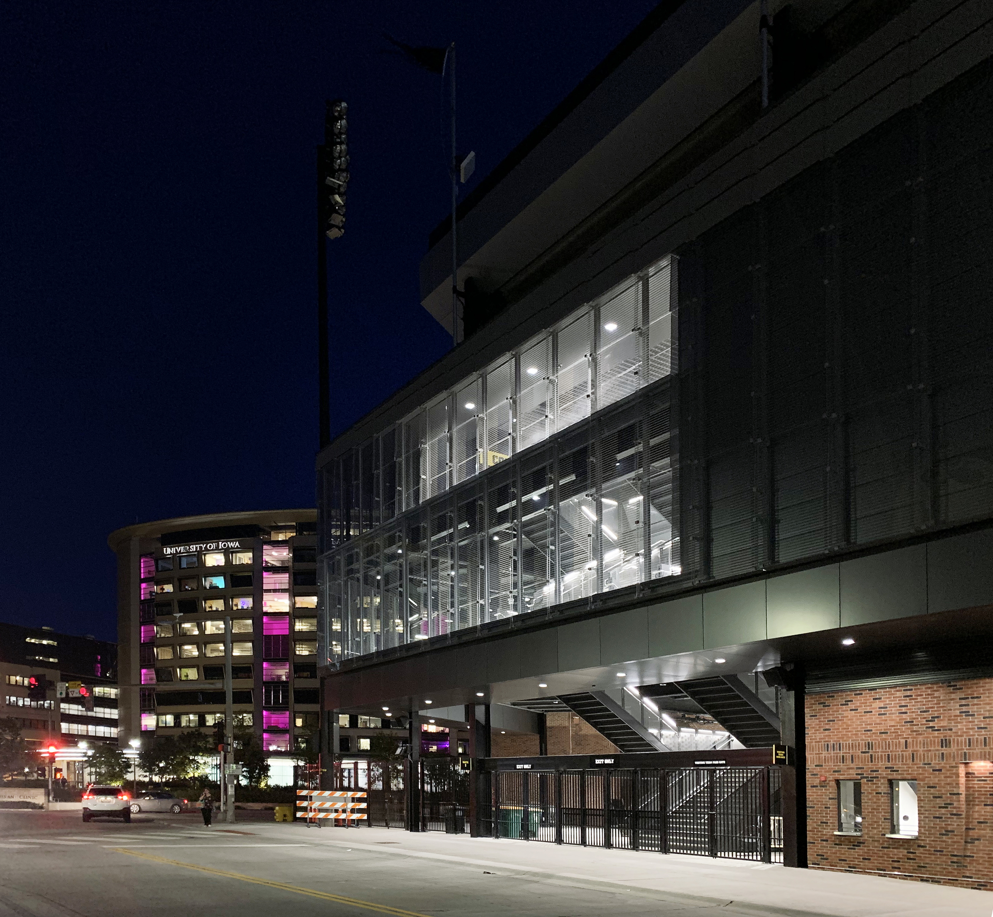 Gallery of How to Construct a Stadium Facade from Custom Glass While on