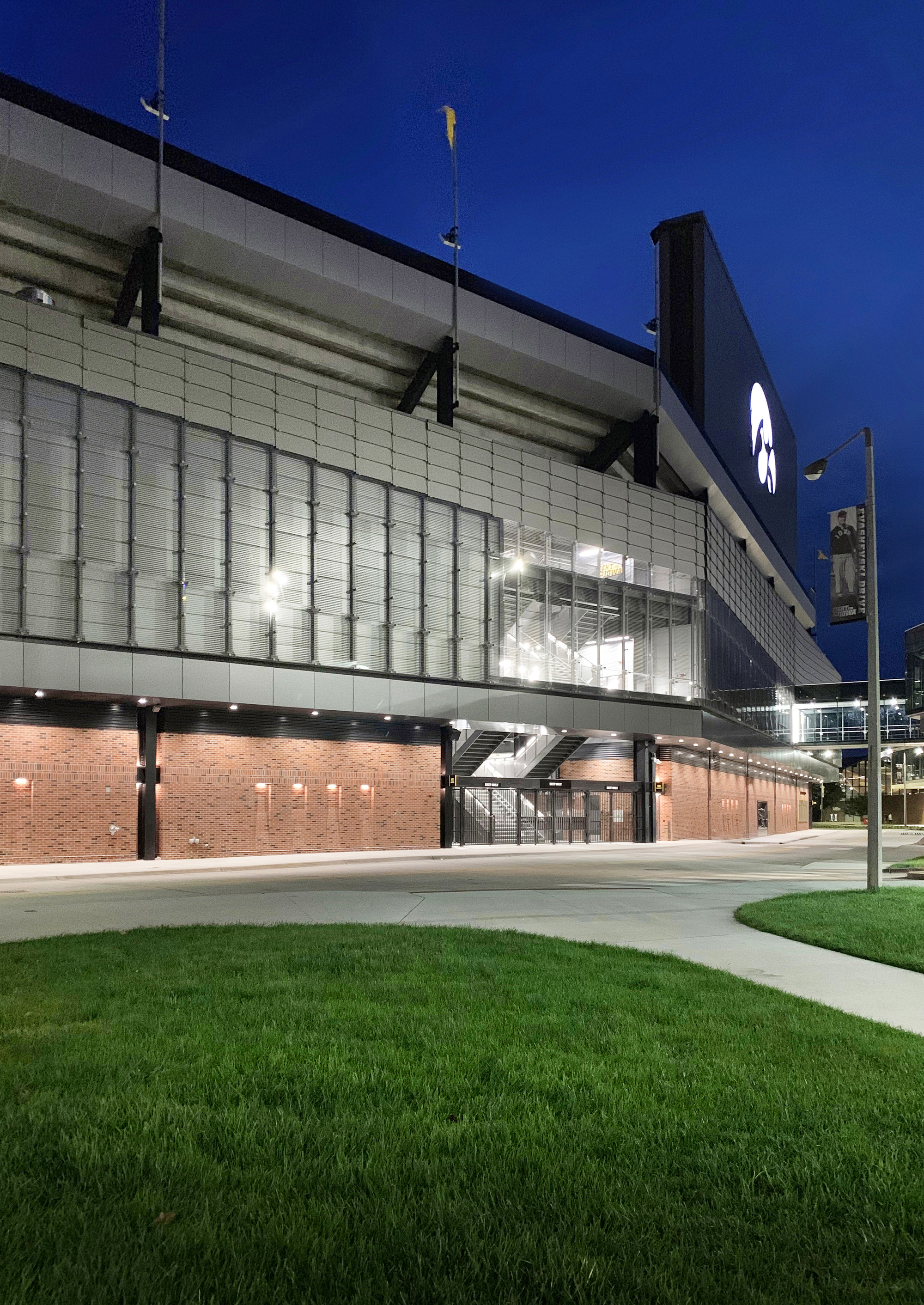 Gallery of How to Construct a Stadium Facade from Custom Glass While on