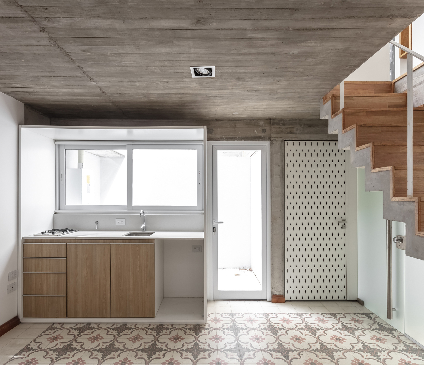 View of Gallery of Exposed Concrete Apartments in Argentina - 11