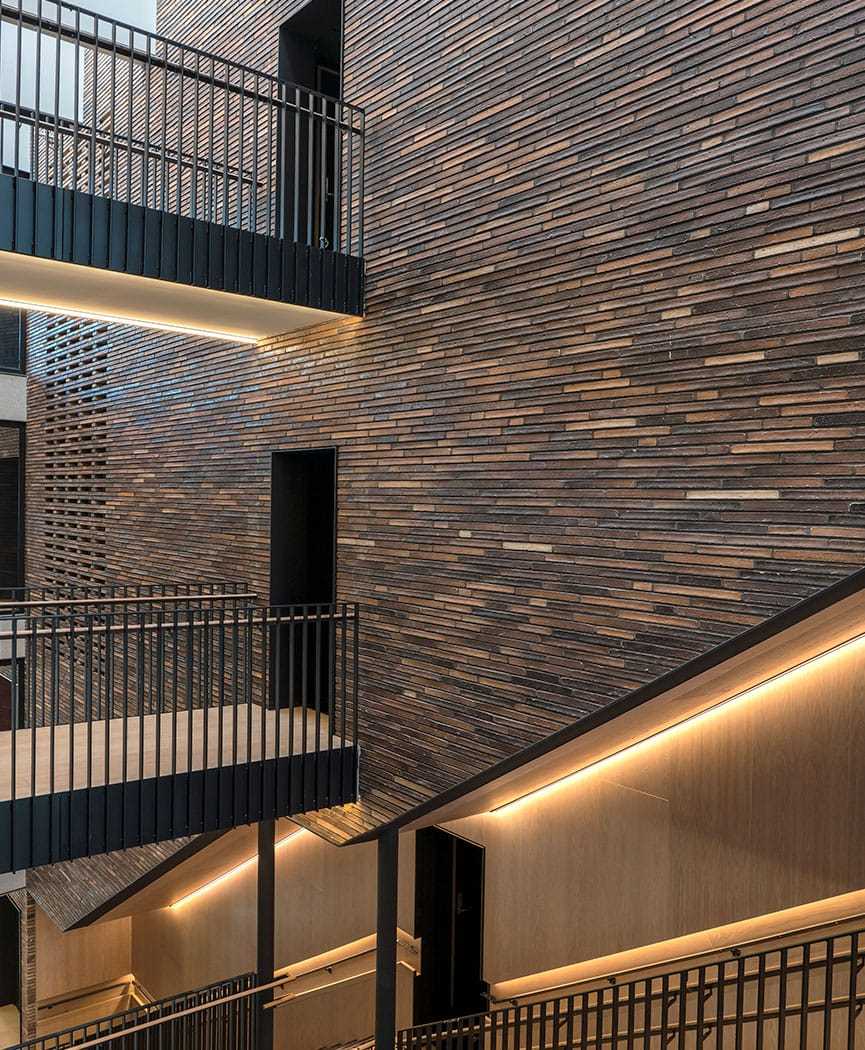 Gallery of long format bricks shaping distinctive facades 16
