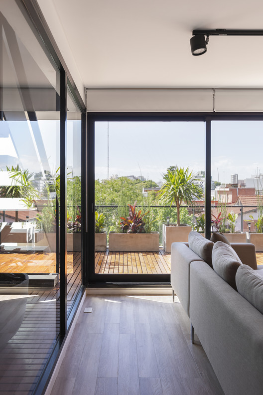 AER La Pampa Building / Cubero Rubio - Interior Photography, Living Room, Wood, Glass