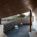 Edificio de actividades de la aldea MaJiaLong / Mix Architecture - Fotografía interior, Puerta, Concreto