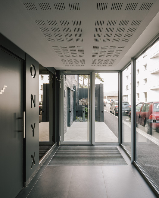 12 Housing Units / a/LTA - Interior Photography, Door, Windows, Facade, Chair