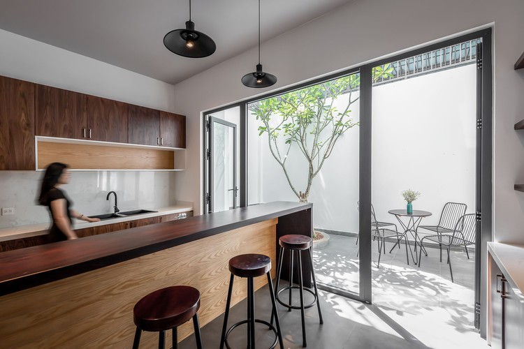 NGỌC House / Story Architecture - Interior Photography, Kitchen, Table, Countertop, Lighting, Chair, Sink, Windows