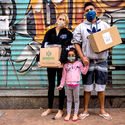 Distributing Imagination kits to kids in Brazil. Image Courtesy of UN-Habitat, Global Public Space Programme