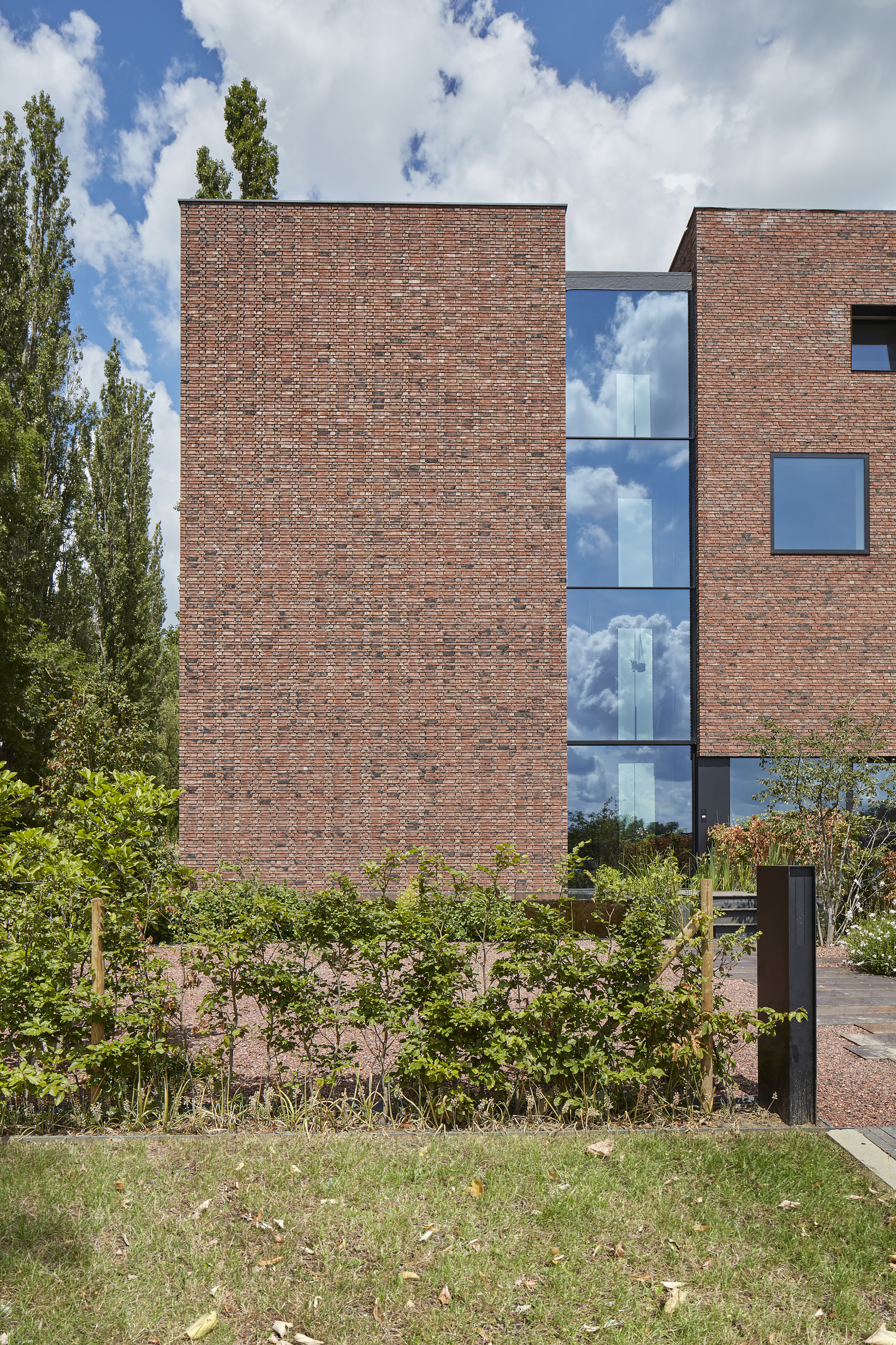 gallery of circular brick house with rammed earth wall ast 77 architecten 7