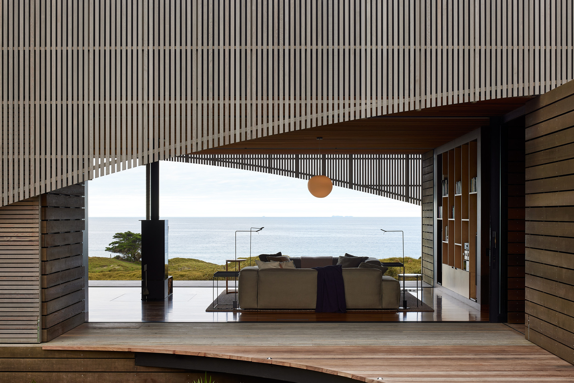 Dune House interior — exposed structure and honest materials define the space