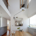 House with Hooked Multi Level Crossing / ihrmk - Interior Photography, Houses, Table