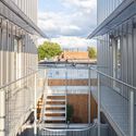 Off Plaza Building / L. McComber  - Exterior Photography, Office Buildings, Facade, Handrail, Fence, Balcony, Stairs