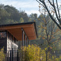 The Campsite Hotel In The Bamboo Forest / Verse Design - Exterior Photography, Visitor Center, Facade, Fence, Forest