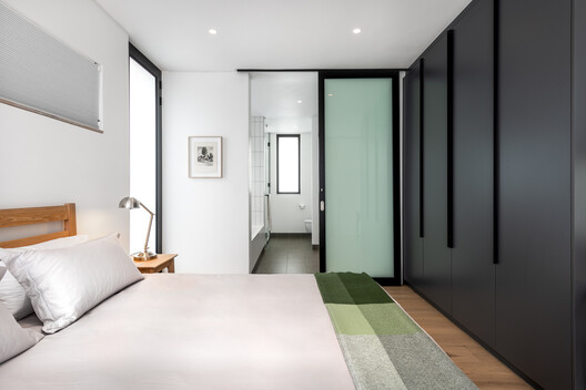 House Steynberg / Two Five Five Architects House Steynberg / Two Five Five Architects - Interior Photography, Bedroom, Bed, Wood, Lighting, Door