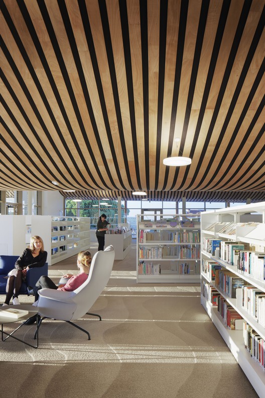 Event Hall L’Agora and Ernest Hemingway Media Library / Ateliers A+ - Interior Photography, Shelving, Lighting, Table, Chair