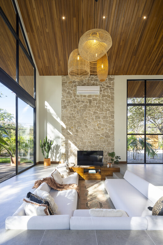 Indo Avellanas House / Garton Group Architecture  - Interior Photography, Living Room, Wood, Lighting, Chair