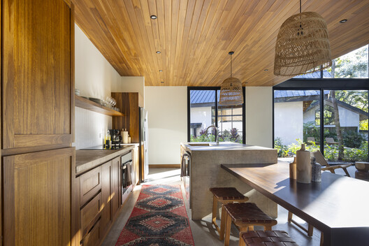 Indo Avellanas House / Garton Group Architecture  - Interior Photography, Kitchen, Wood, Countertop, Lighting, Table, Chair