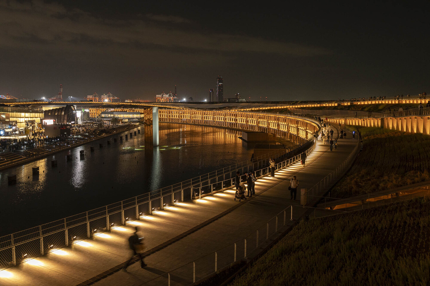 Bradfield City Centre, a flat wooden building with lots of beams and windows under a bright but cloudy sky.