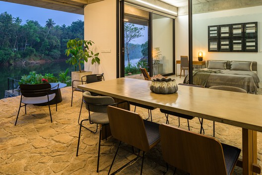 The House That Meets the River / LIJO RENY architects - Interior Photography, Dining room, Wood, Table, Chair