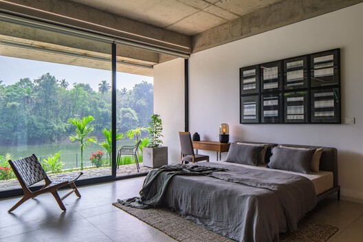 The House That Meets the River / LIJO RENY architects - Interior Photography, Bedroom, Wood, Bed, Chair