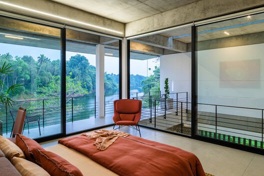 The House That Meets the River / LIJO RENY architects - Interior Photography, Living Room, Chair, Bedroom