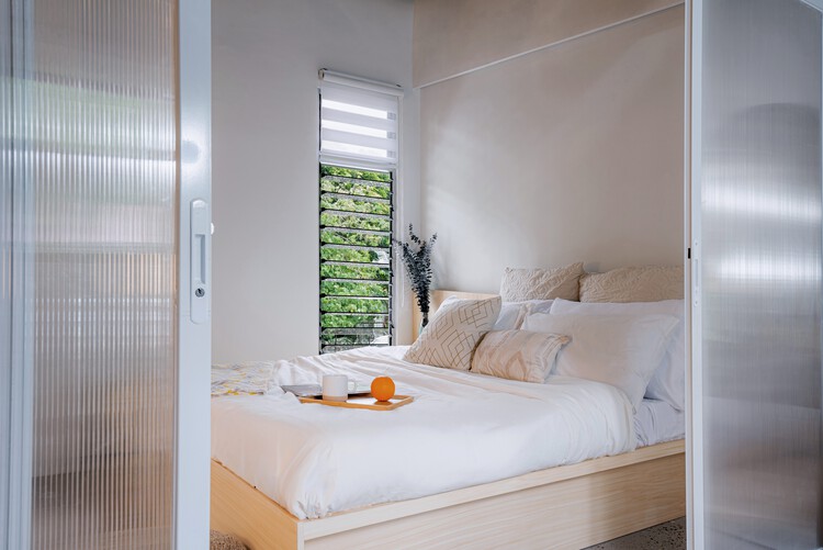 Sienna Net-Zero Home / billionBricks 15 Sienna Net-Zero Home / billionBricks - Interior Photography, Bedroom, Bed, Wood, Lighting, Door